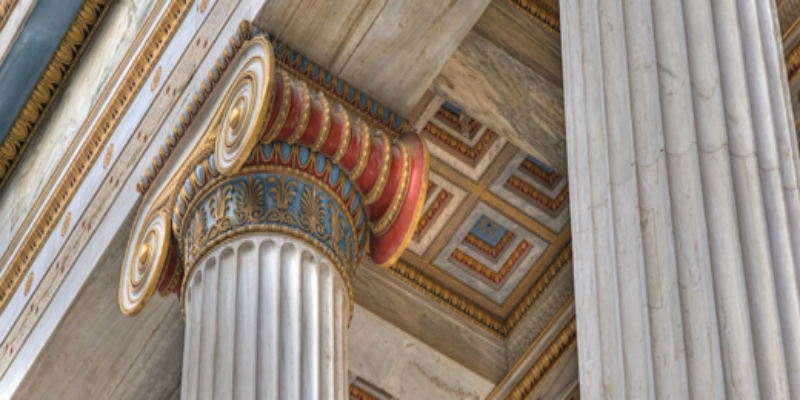 A photo of a decorative pillar in the ancient Greek style.