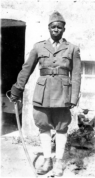 Addi Ba with his famous sword in Tollaincourt (Vosges), in front of the house he was staying in, 1943.