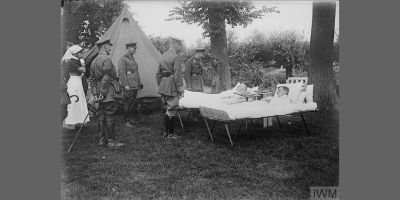 King George V conversing with officers at a Casualty Clearing Station at Remy, 14th August 1916.