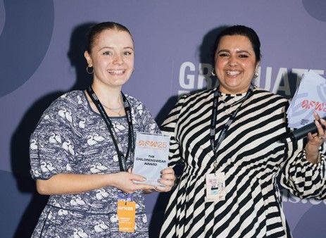 Two students receiving an award
