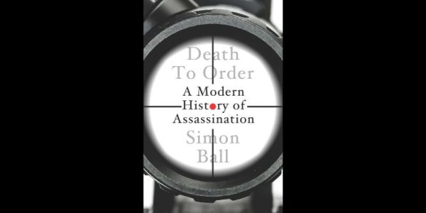 The cover of Death to Order. Macro image looking down the barrel of a gun with sights.