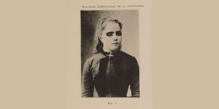 A photograph of a woman in Edwardian clothing. Her eyes have been coloured in to give her anonymity