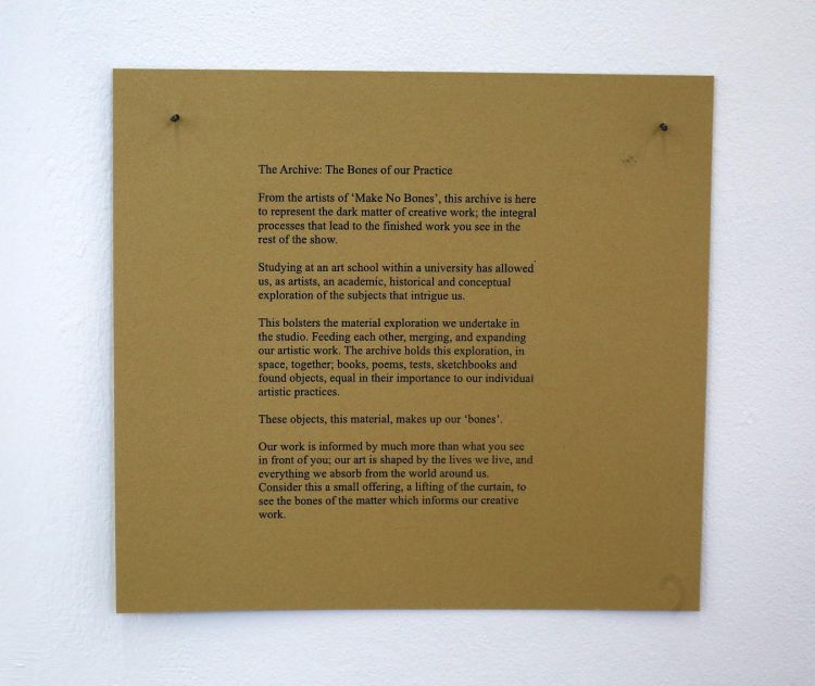 Square board describing The Archive at the Make No Bones BA Fine Art Degree Show