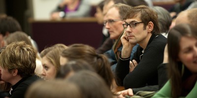 Group of people in an audience at a talk