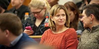 Group of people in an audience at a talk