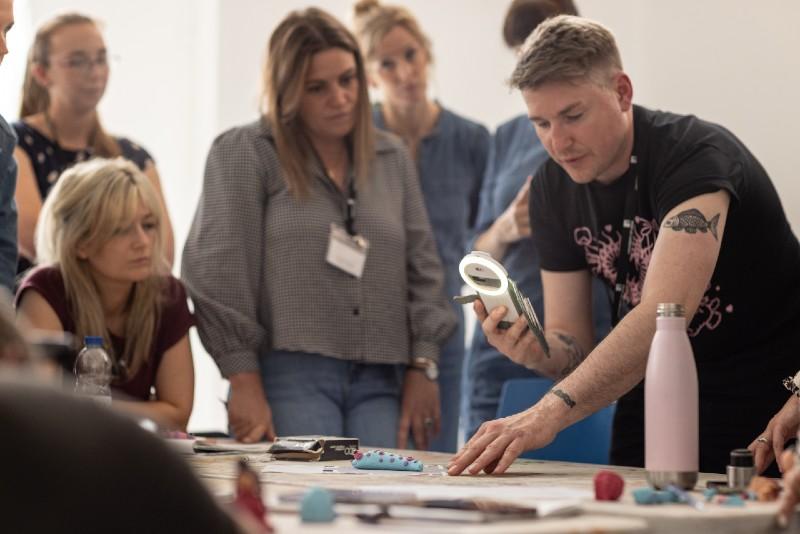 A group of teachers working in an art studio