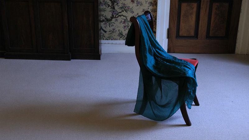 Installation by Azadeh Fatehrad - fabric draped over a chair