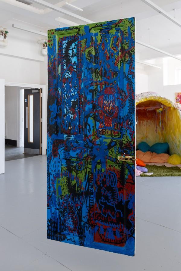 Tianna McIntosh’s winning artwork, the world as it is (or as it Should Be), 2023, Oil stick and acrylic paint on found wooden door. Can you let us in? BA Fine Art Degree Show, June 2023. Installation photo by Jules Lister.