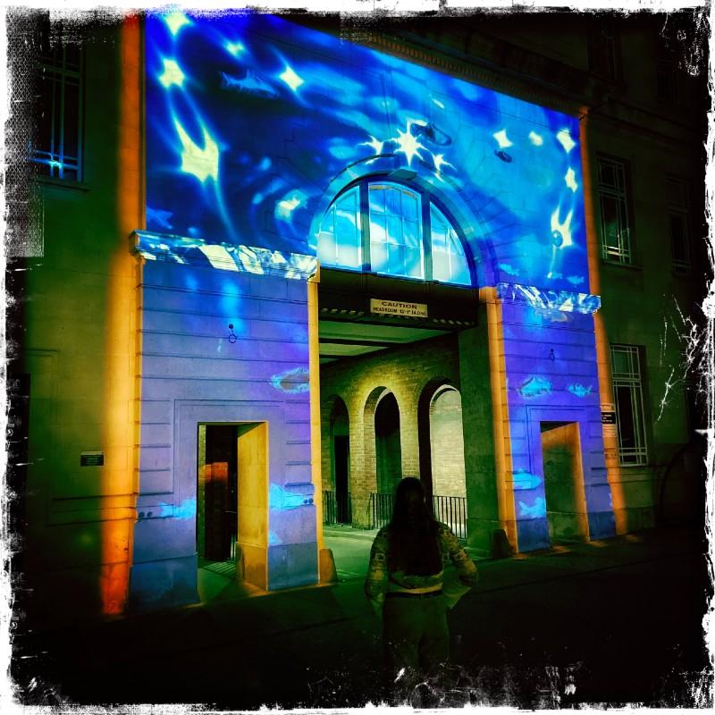 Light can also Rhyme artwork projection onto the stonework of the Sir William Henry Bragg Building at the University of Leeds
