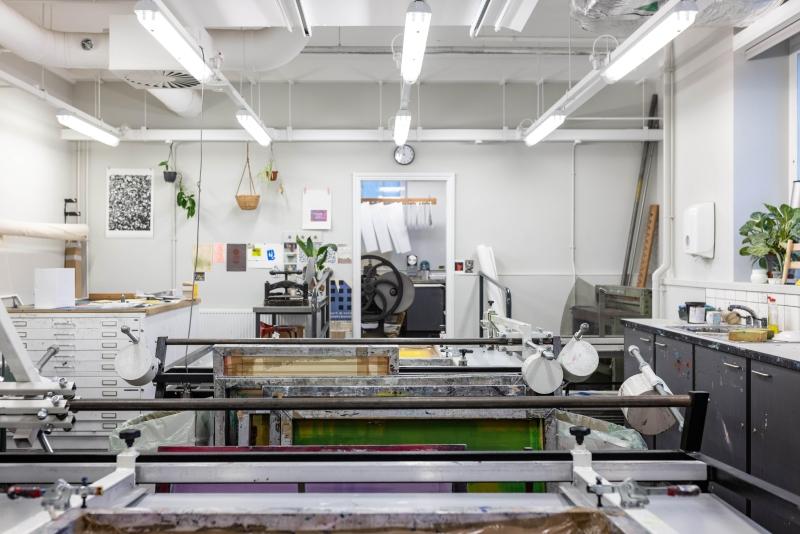 Printing workshop in the School of Fine Art, History of Art and Cultural Studies showing the equipment such as screens, and the adjacent printing room.