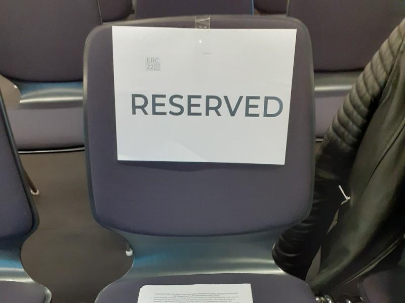 Lecture theatre chair with reserved sign