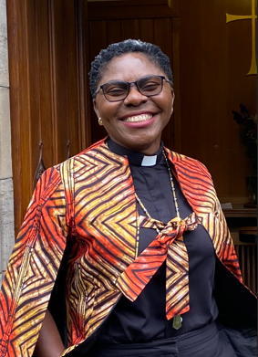A woman smiles for the camera