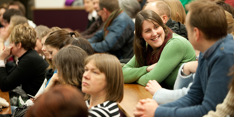 Group of people in an audience at a talk