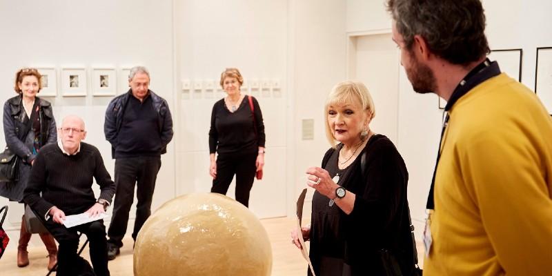 Griselda Pollock and Sam Belinfante giving a talk to a group of people at the launch of the during the Lessons In the Studio: Studio in the Seminar exhibition launch, The Stanley & Audrey Burton Gallery at the University of Leeds