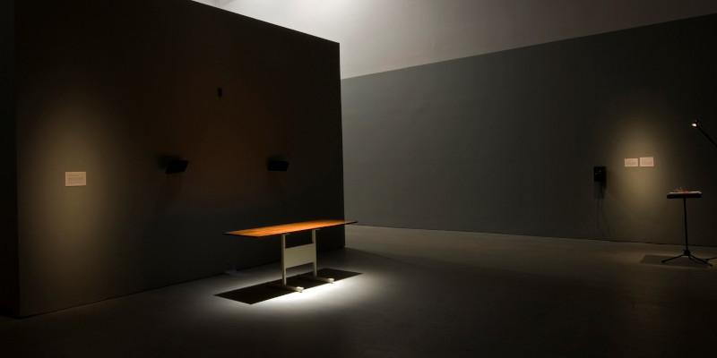 sound art installation on a table top in a dark gallery space