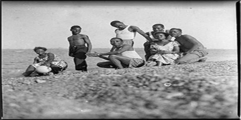 A black and white image of a group of people.