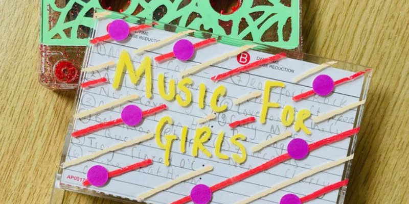 A tape cassette case with 'Musics for Girls' written on it