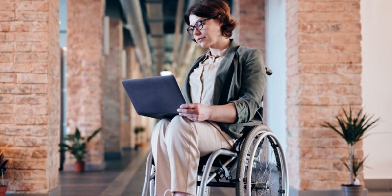 Woman in wheelchair on laptop