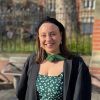 Emma Jacobs wearing her University of Leeds graduation attire and smiling