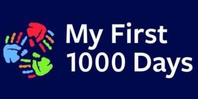 Three small handprints in a circle. Text reads: My First 1000 Days.