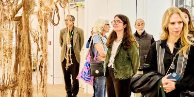 Visitors attending an exhibition opening