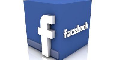 The 'Facebook' logo in white, wrapped around a blue cube