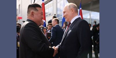 Kim Jong-Un and Vladimir Putin shaking hands