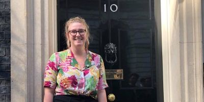 Megan Houston stands by the door of No 10 Downing Street