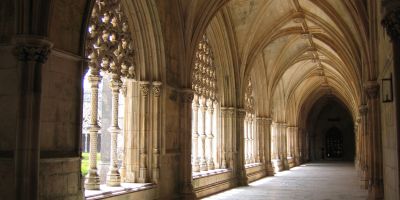 A cloister in a church, shrouded in shadow