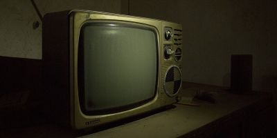 Sepia toned old analogue cathode ray tube TV set
