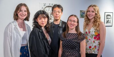 Five artists in a gallery space