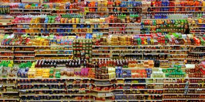 A supermarket seen from above, with hundreds of products in brightly coloured packaging