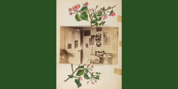 A page from an old book. Aprigs of pink flowers are painted on the page. On top of them, a sepia photograph has been glued on. It shows the interior of a Victorian room.