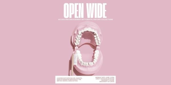 A model of a set of teeth with a toothbrush against a pink background