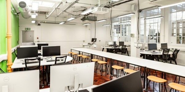 A white room with computers and technology