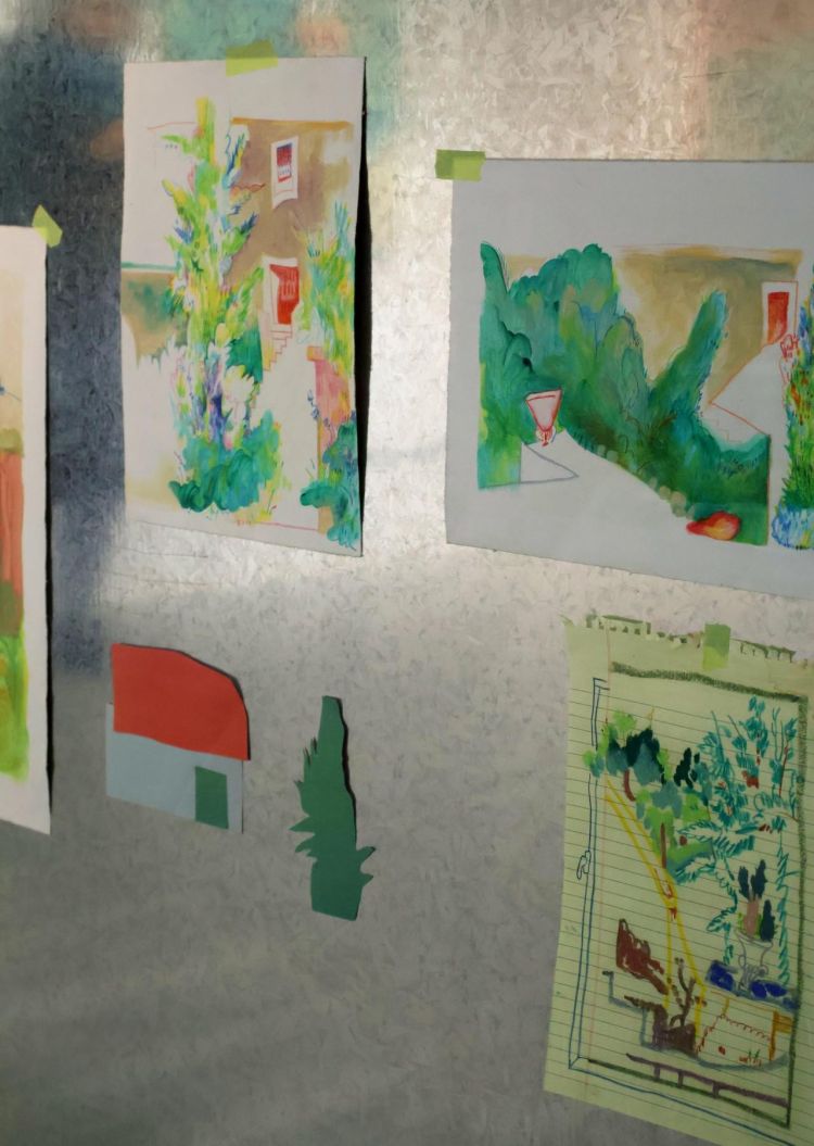 Artworks taped to a wall