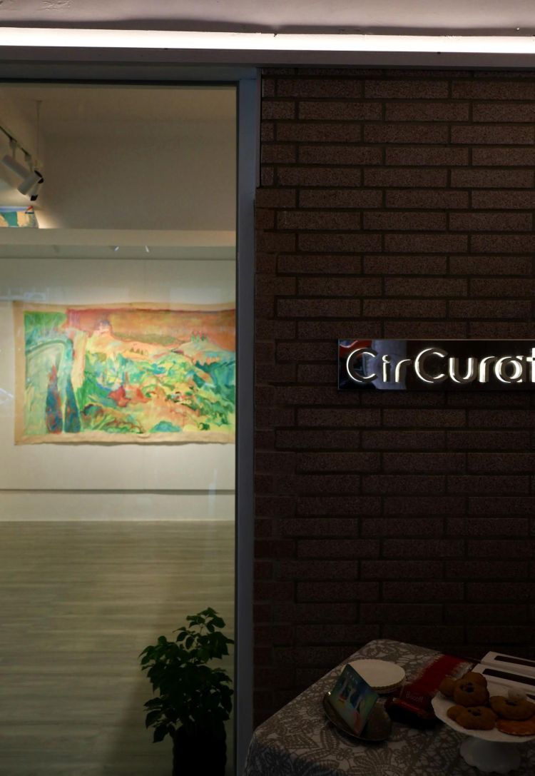 Looking through a window to an exhibition of art works