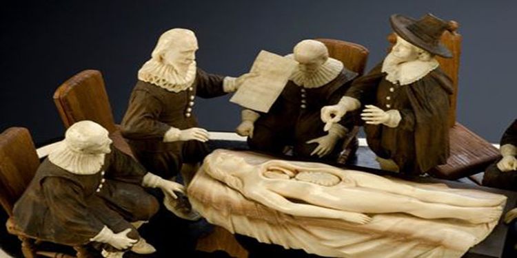 Wood and ivory figure group representing an anatomical demonstration by Nicholas Tulp, based on Rembrandt&rsquo;s painting: The Anatomy Lesson. (Detail view of patient and figures. Graduated black background. Science Museum. London, CCBY)