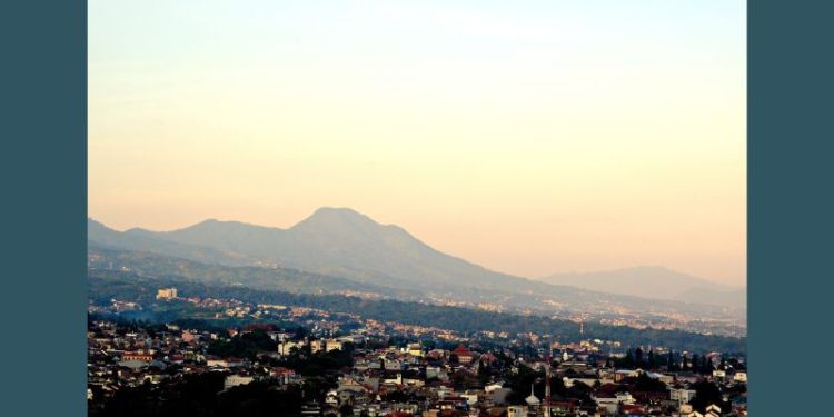 Sunrise over the mountains of Bandung, Indonesia. The city is seen in the foreground.