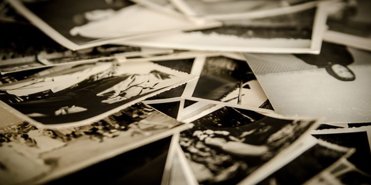 A pile of black and white photos.