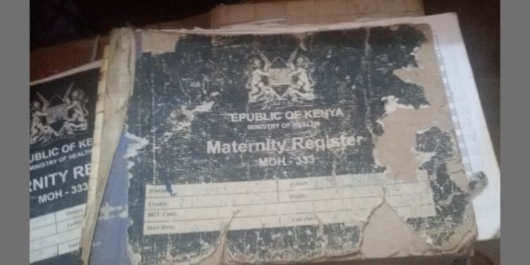 Blue books, quite old and damaged. Text reads Republic of Kenya Ministry of Health Maternity Register