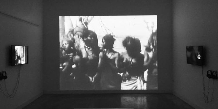 Black and white photo of a video installation entitled Installation shot: No Dance, No Palaver (2017–2018). In '[POST] Colonial Bodies I', MUNTREF, Buenos Aires, 2019. 