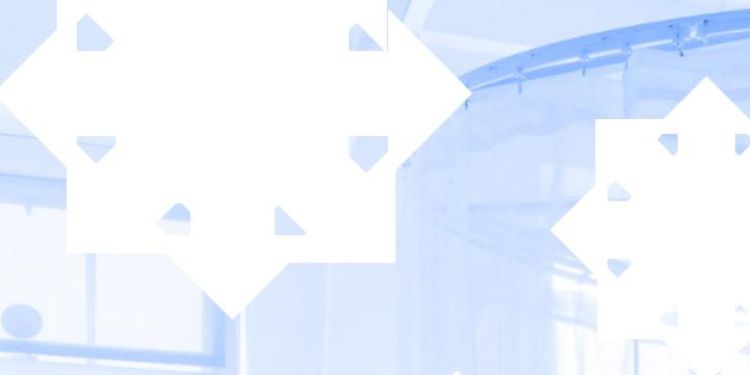 Cut out snowflakes with a pale blue background