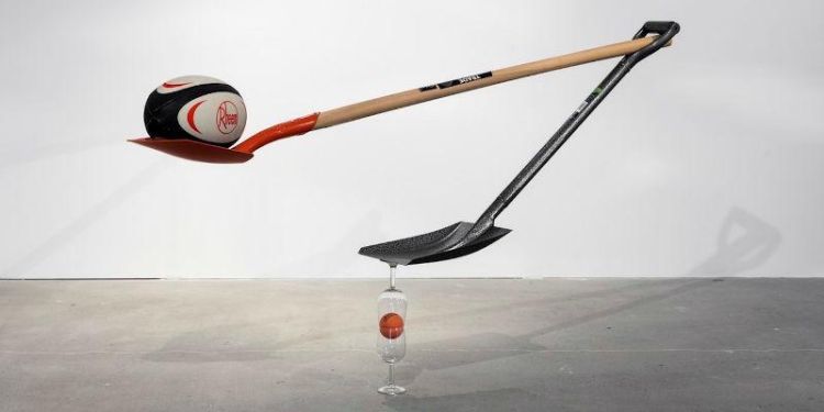 Untitled installation using rugby ball, shovels, hi-bounce ball, wine glasses by Matt Calderwood