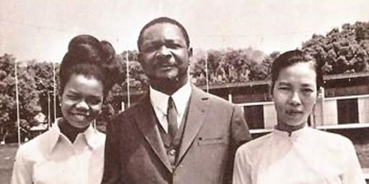 Old black and white photo of a man and two women