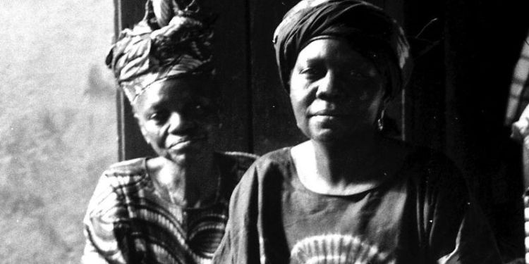 Image of women selling stencilled Adire in Ibadan, Nigeria. Photo by Will Rea.