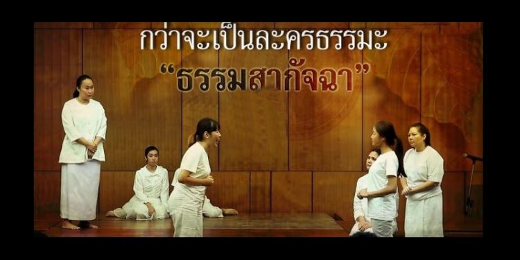 Thai females dressed in white performing a play
