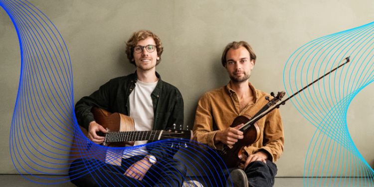 two men sat with string instruments