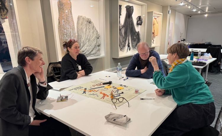 People at a table engaged in discussion