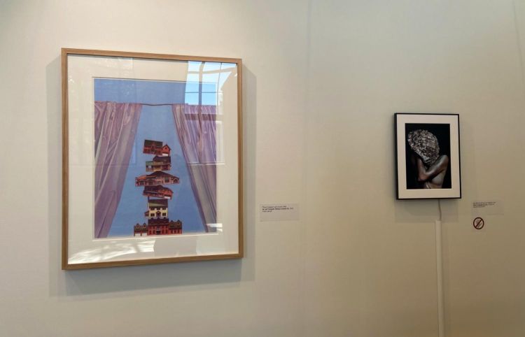 Artworks in a gallery. On the left is Arc de Triomphe (Victory Column IV) by Thom Sawyer,. On the right is Silent Language of Love by Mai Elbastawessy.